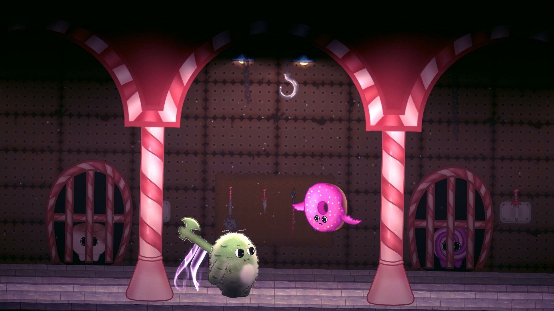 Pom, weapon in hand, faces a flying pink donut in a candy-cane factory hall.